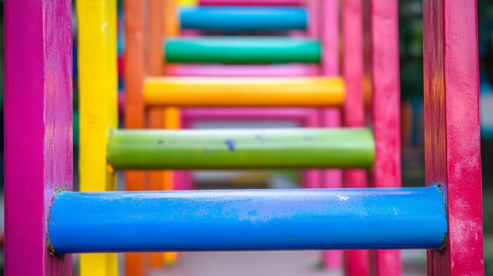 Close-up of colorful monkey bars on a playground
